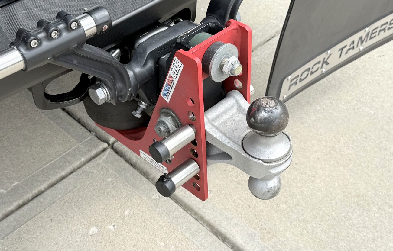 Close-up of the Shocker Hitch Air pivot-point hitch and its air cylinder