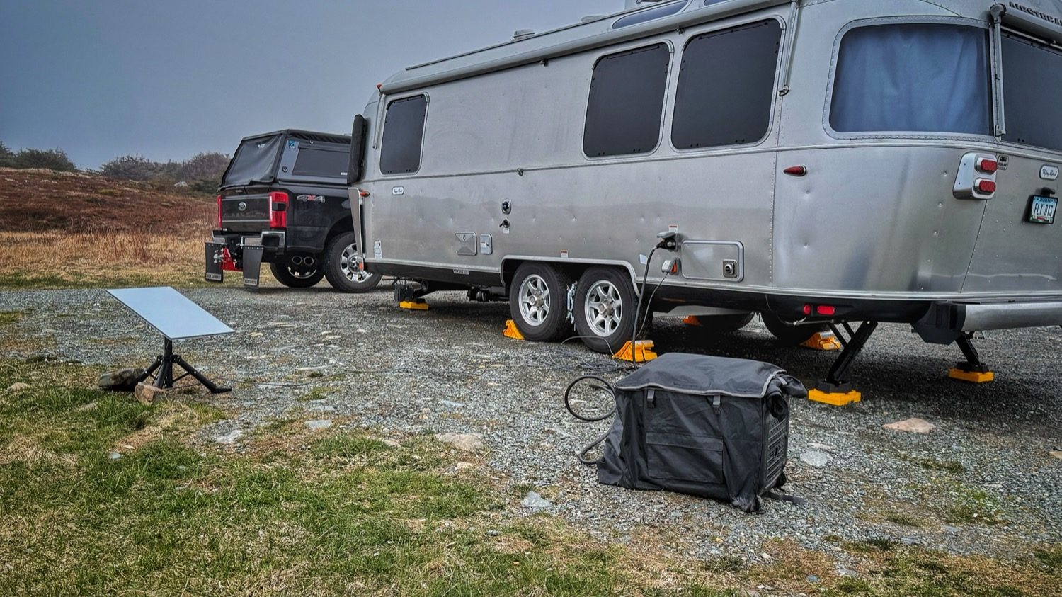 Our Airstream leveled and set up on the gravel pull-off, with the truck parked alongside