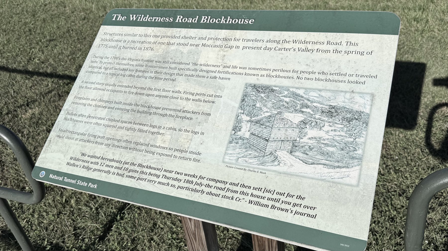 The Wilderness Road Blockhouse interpretive sign at Natural Tunnel State Park, with a pencil drawing of the log blockhouse beside text about how frontier blockhouses were built